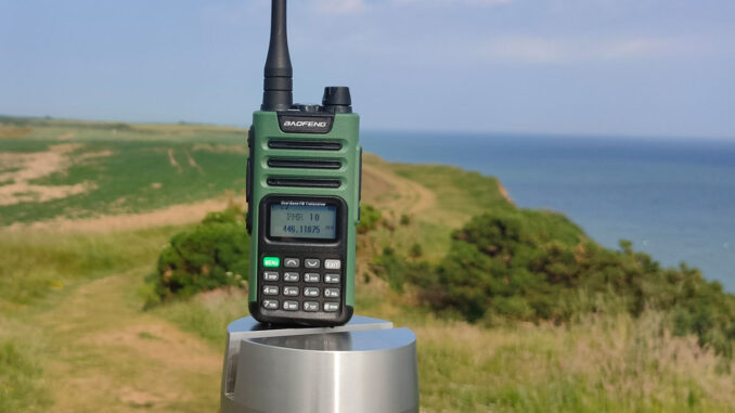 A Baofeng UV-13 Pro two way radio in scenic location